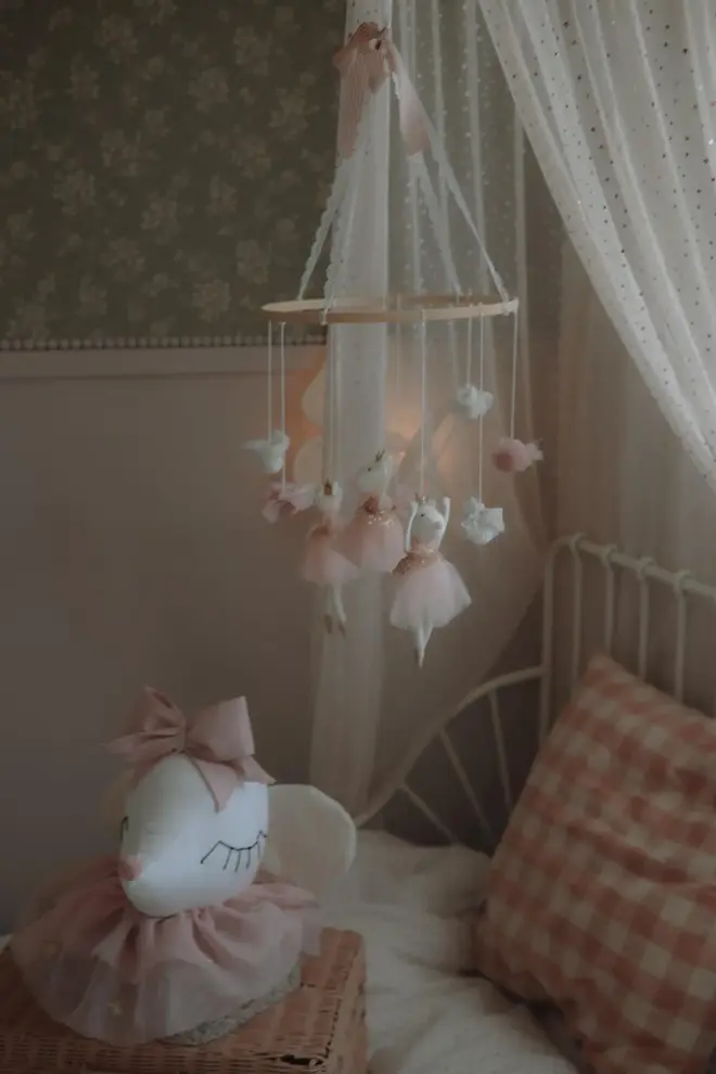 Hanging Mice Ballerina Felt Carousel Decoration, a hanging mice carousel decoration suspended in a child's decorated bedroom. 
