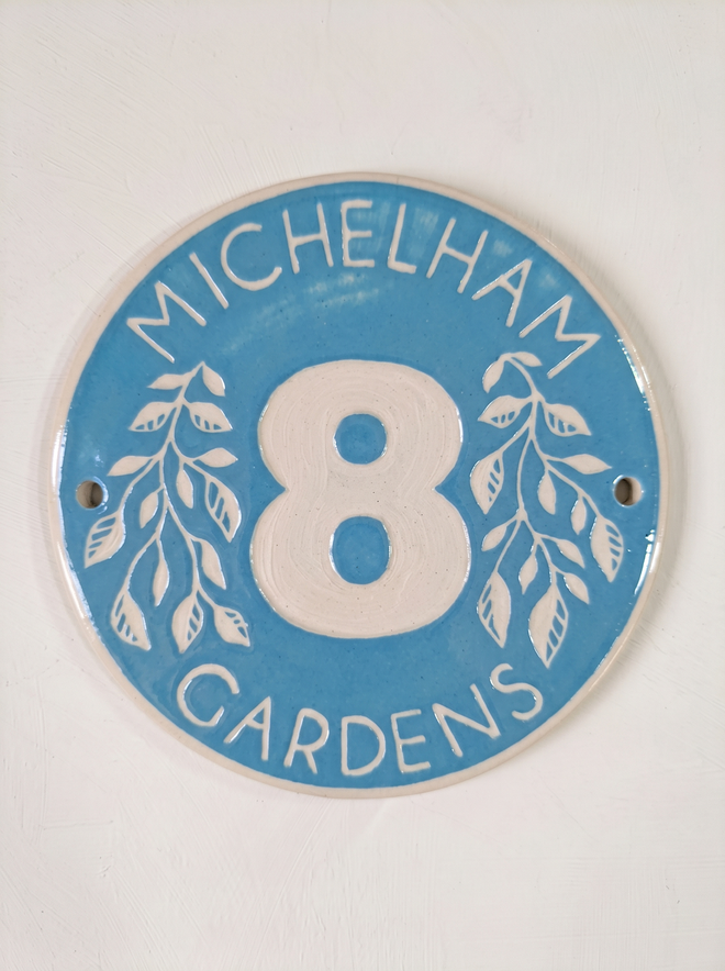 Light Blue Large Round Door Number with Text and leaf Sgraffito decoration