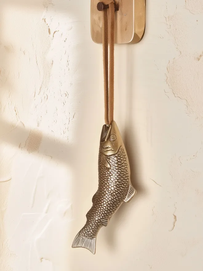 brass hanging decoration with suede cord