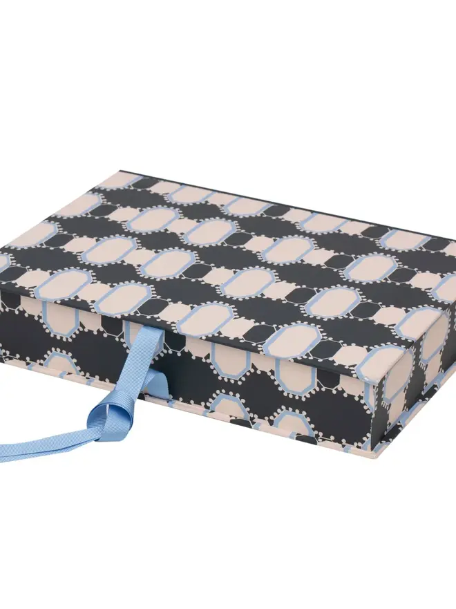 Lidded Portfolio Box, a colourful portfolio box sitting on a plain surface. 