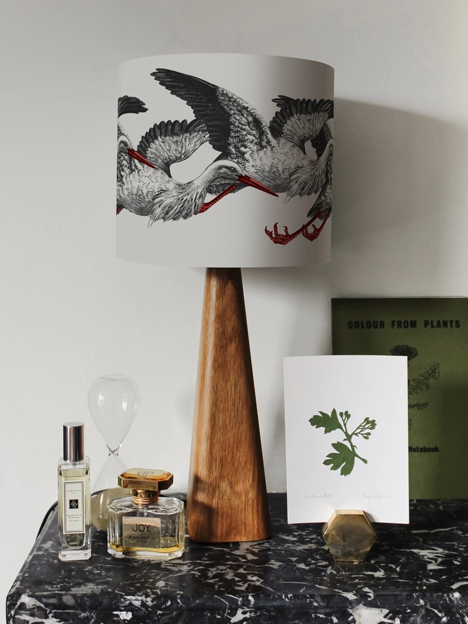 Elegant lampshade featuring elegant storks on a stylish, playful design.