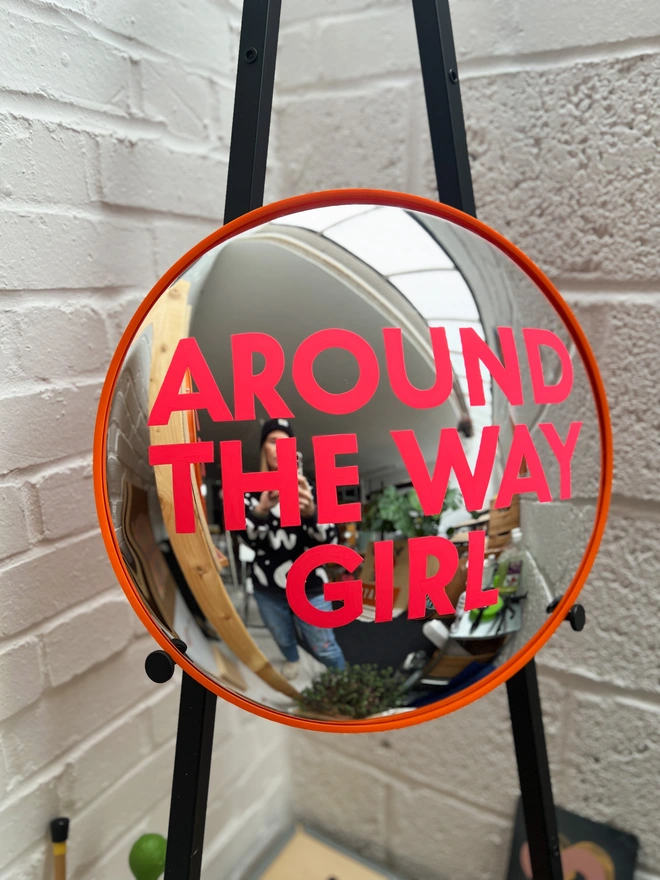 Convex painted mirror around the way girl