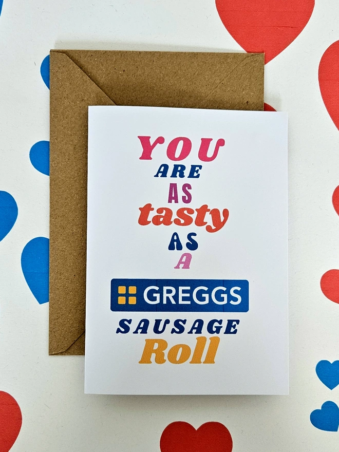 A humorous valentine greeting card that says you are as tasty as a Greggs sausage roll in colourful text in different fonts