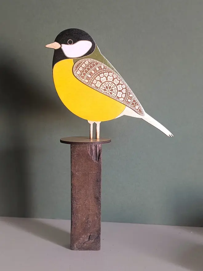 Standing Wooden Great Tit, yellow wooden bird decoration standing on a platform. 