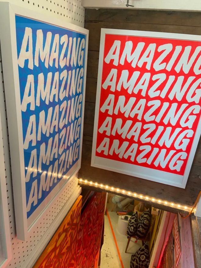 Fluoro Amazing Print. Two prints, one blue, one red, set next to each other.