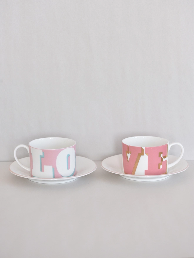 2 love cups and saucers