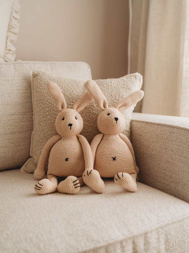 handmade crochet bunny rabbits on sofa