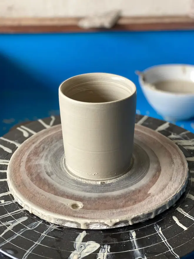 'St Helena' Soy Wax Candle And Ceramic Holder. ceramic pot being made in pottery studio.