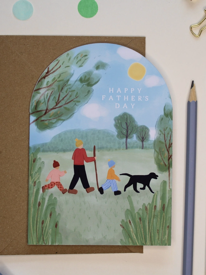 arch shape fathers day card featuring a family walk in nature
