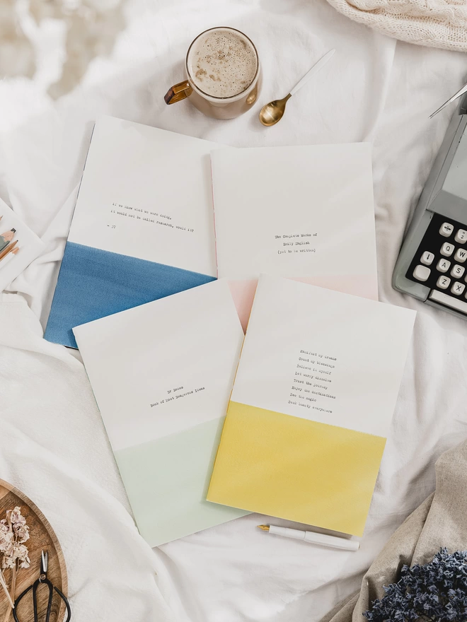 Blue, green, yellow, pink and white personalised A4 notebooks