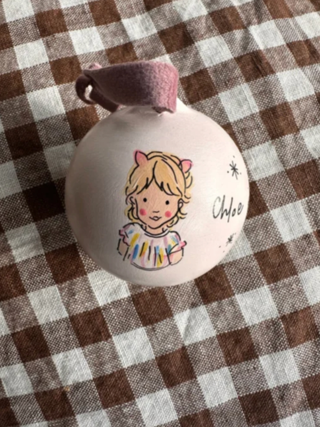 Personalised Illustrated Bauble. A bauble with a personalised illustration.