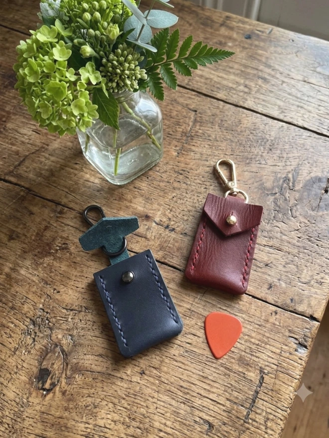 navy and red leather plectrum holder