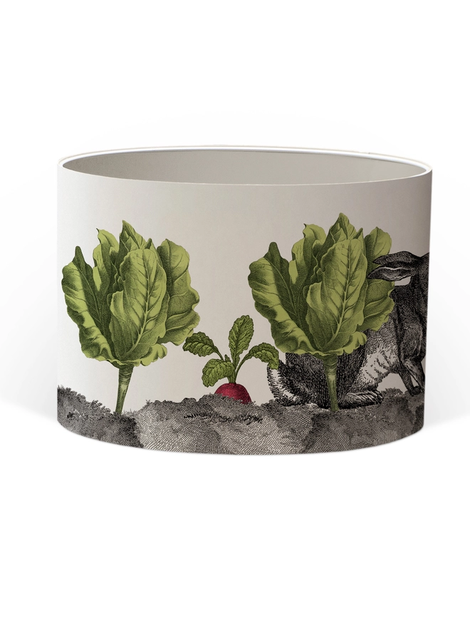 Mischievous rabbit lampshade handmade with vintage animal etchings, hiding among lettuces and radishes in a quirky country-style design. 