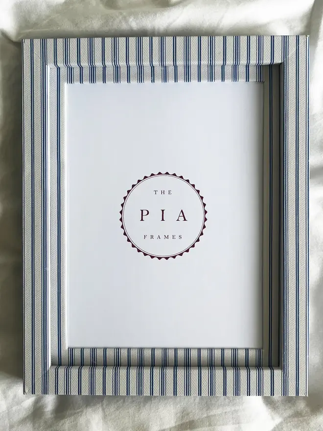 Rustic Blue Stripe Frame, a striped colourful frame sitting on a plain white surface. 