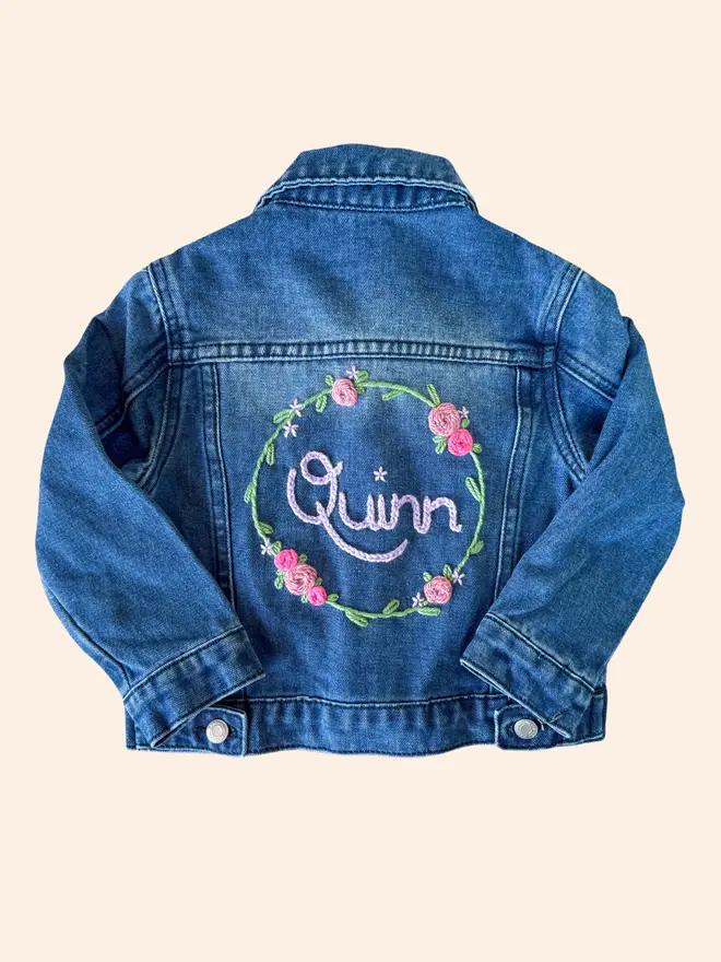Hand-embroidered denim jacket with floral wreath