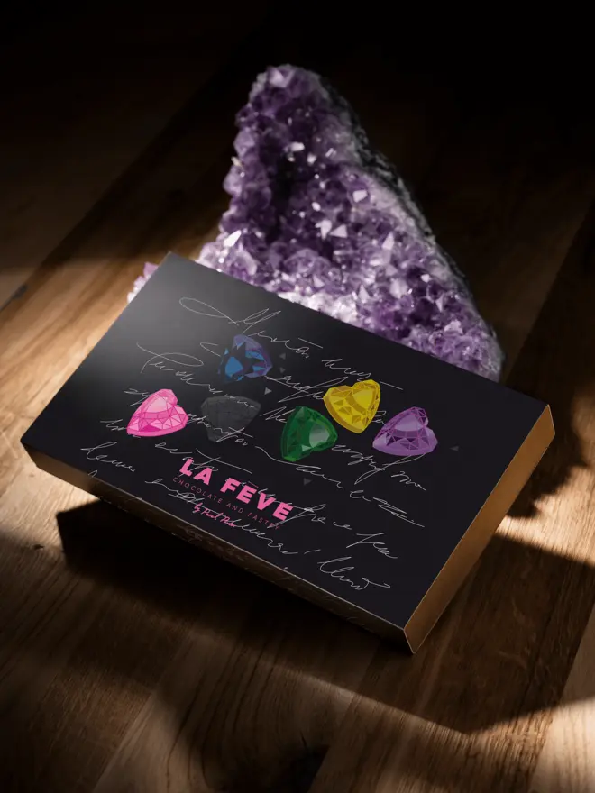 la feve chocolate sleeve with heart chocolate graphics on black background