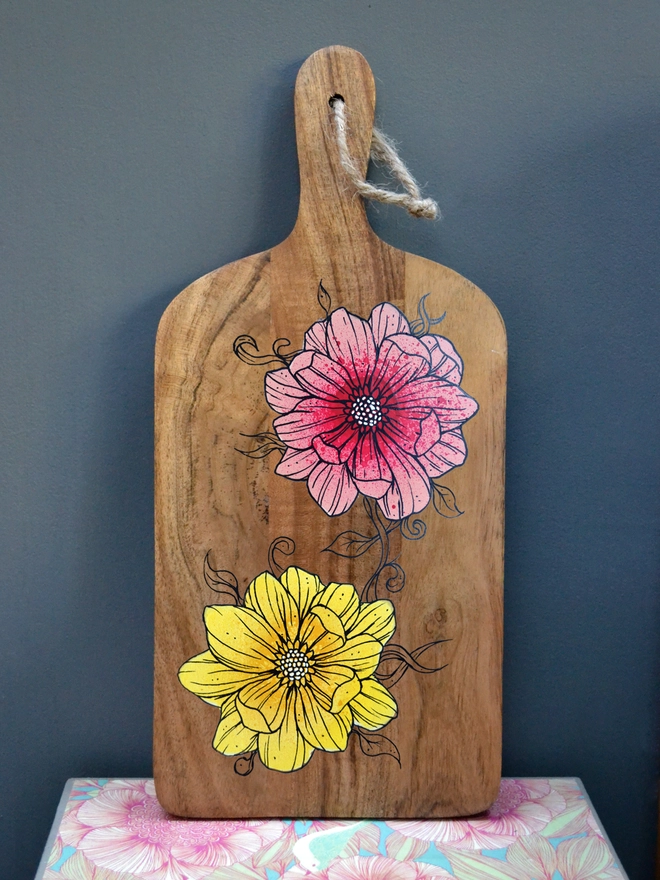 Handpainted serving board with a design of roses