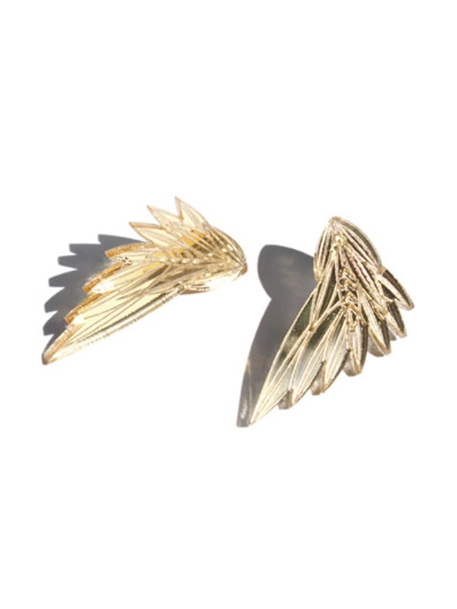 Wing structured Earrings made from gold acrylic with intricate etchings.