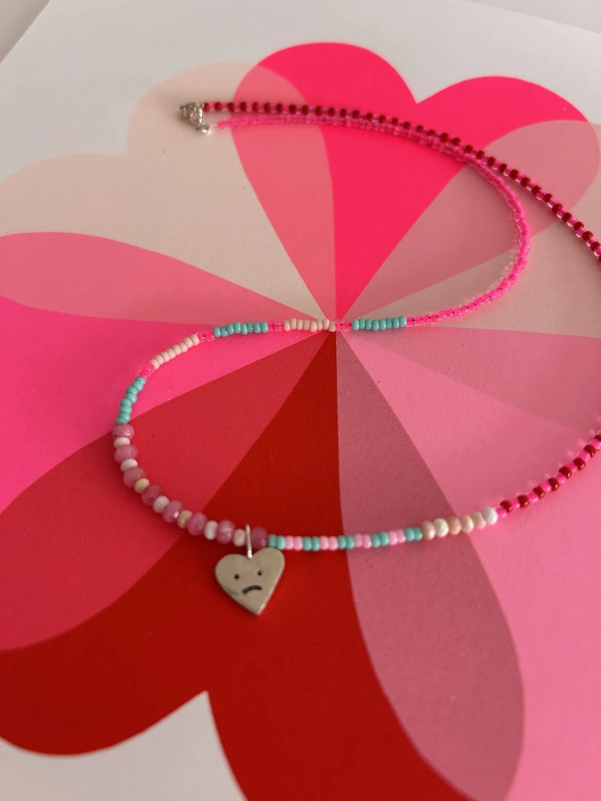 Beaded Heart Necklace, ed and neon pink beads Solid silver happy heart charm