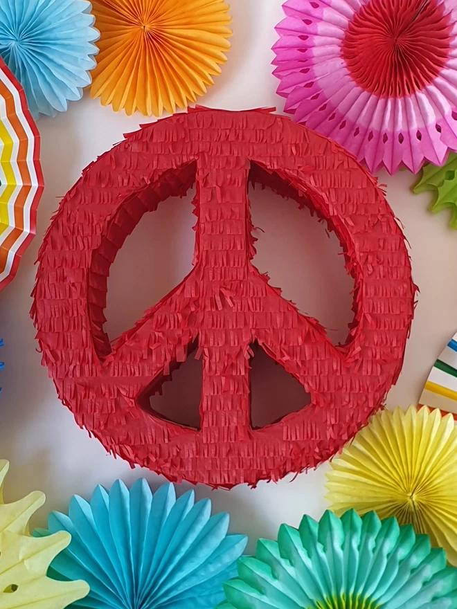 red peace sign pinata for birthday party games