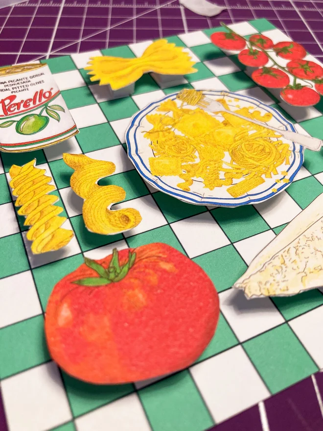 Colourful framed collage featuring Mediterranean food, with vibrant pasta dishes, tomatoes, and olives, set against a green and white checkered backdrop.