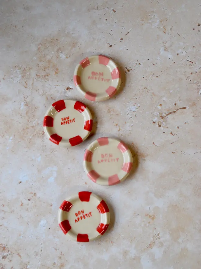Handmade ceramic plate magnets — red and cream striped design with “Bon Appetit” text