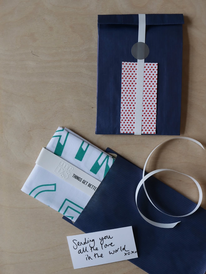 Optional gift wrap of navy paper, ribbon and spotty gift card