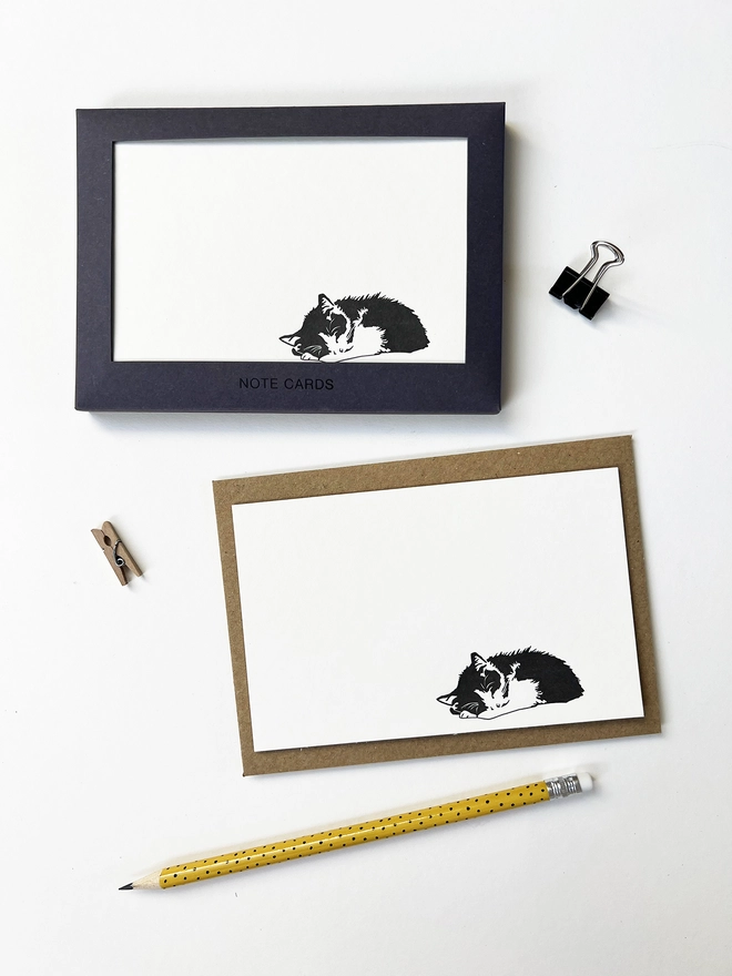 Boxed flat correspondence cards illustrated with a sleeping cat