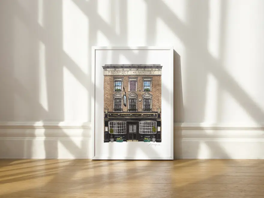 Wapping Prospect of Whitby Giclée Print (Unframed), a print of a pub sitting in a white frame on a wooden surface against a plain backdrop. 