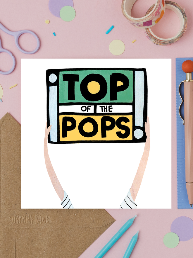 'top of the pops' illustrated fathers' day card. illustrated hands holding up a retro radio emblazoned with 'top of the pops'.
