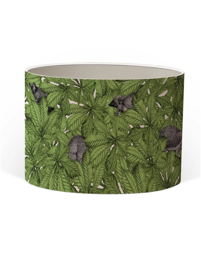 Drum Lampshade featuring hedgehogs in green leaves with a white inner on a white background