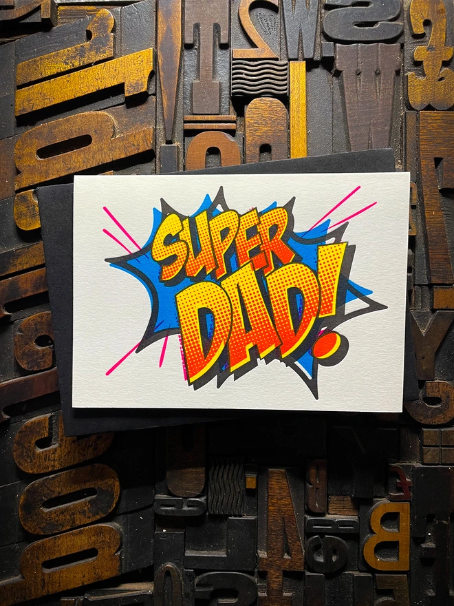 Pop Art Fathers day typographic letterpress card with fluorescent ink made by hand. Deep impression print. Unique with no print being the same. Vibrant colours with matching premium envelopes. With luxurious contrasting coloured envelopes.