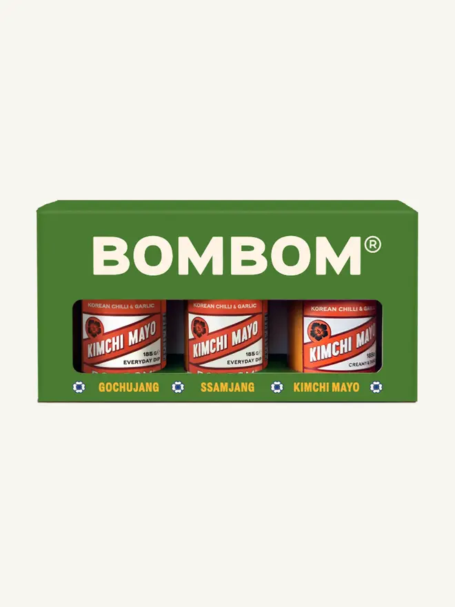 korean kimchi mayo. three jars of kimchi mayonnaise with red labels.