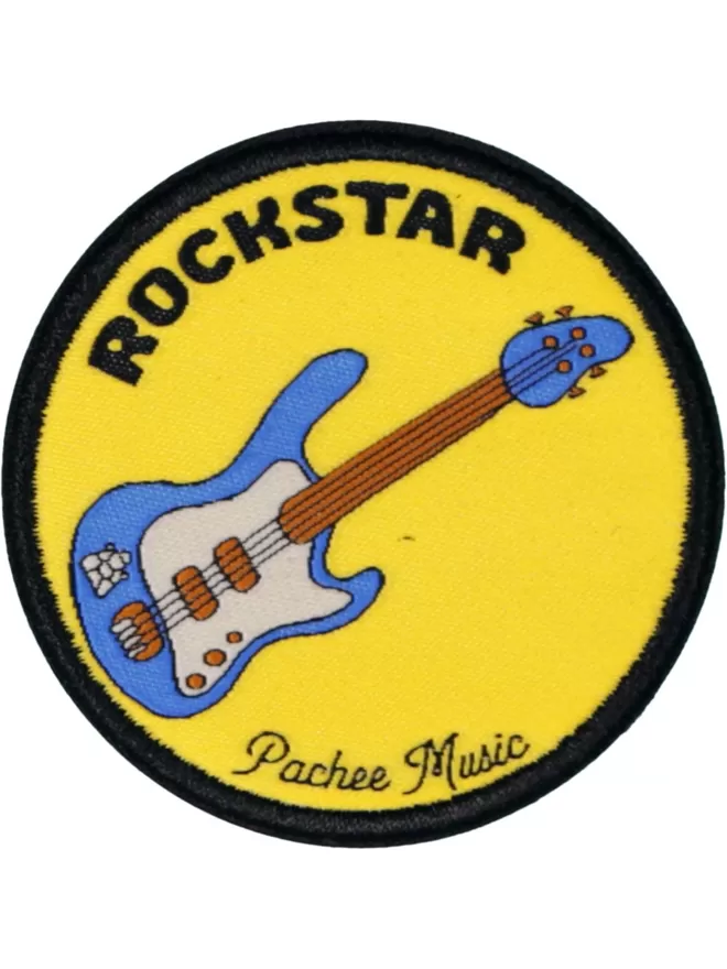 A circular yellow patch with 'Rockstar' written in bold lettering. Across the patch is a blue electric guitar with the Pachee logo.