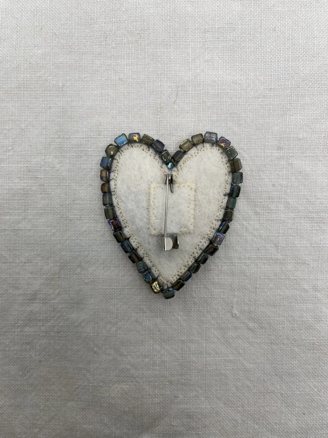 back view of pink and yellow brooch