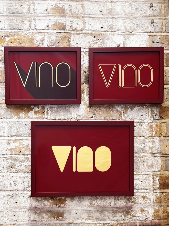 'Vino' Wine Serie Gold Leaf Glass Artwork, hanging in an exposed brick wall. 