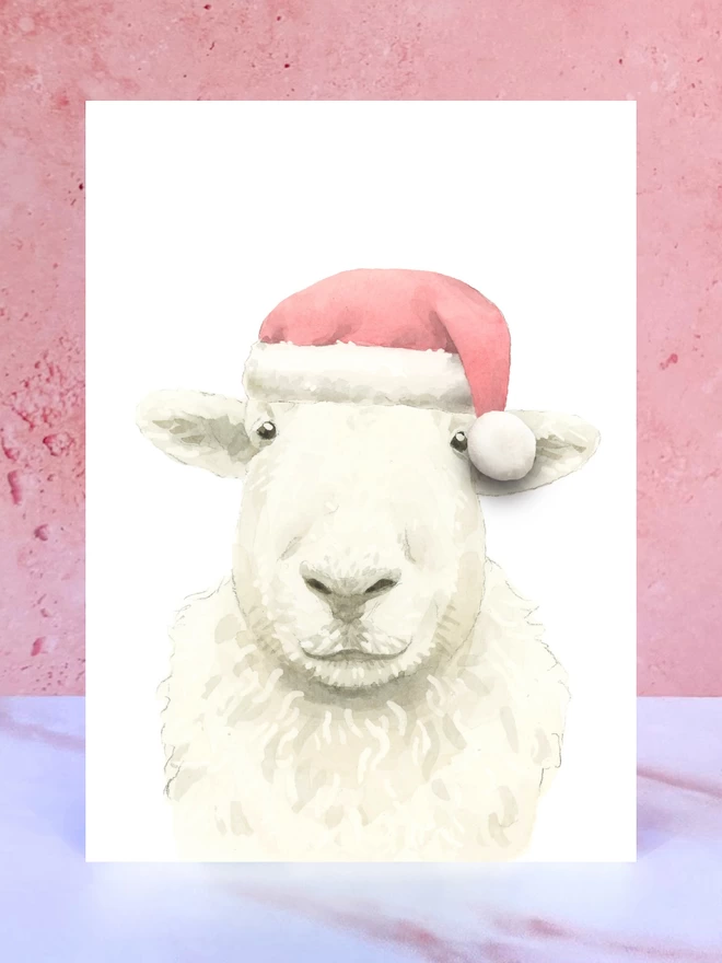 A Christmas card featuring a hand painted design of a sheep, stood upright on a marble surface. 