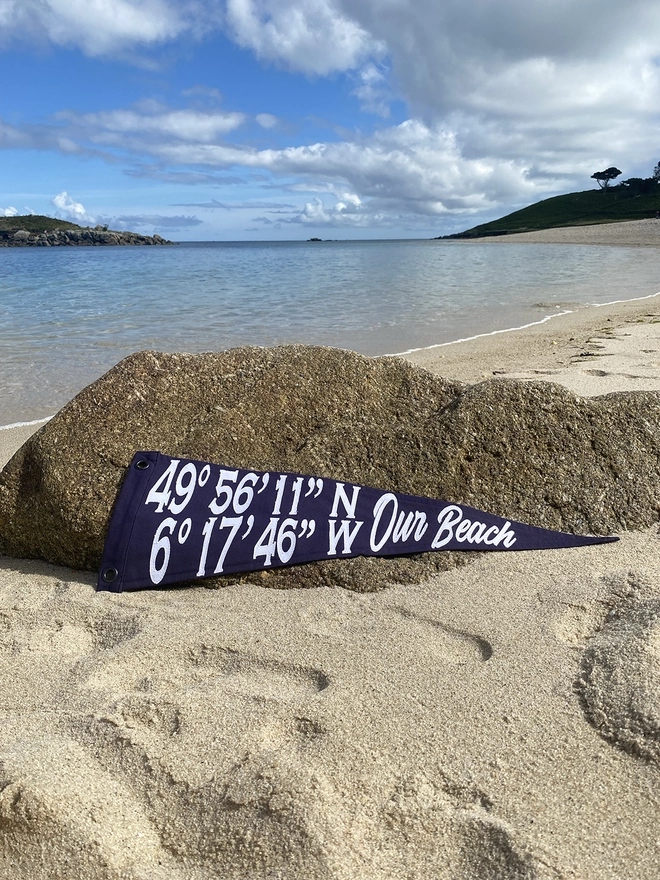 Bespoke coordinate pennant flag displayed on the location that it was made for