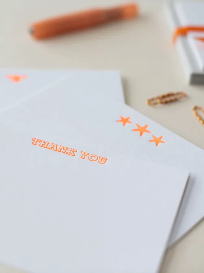 Neon Orange Thank You Notecards by South London Letterpress seen with neon star cards.