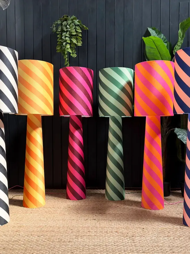 Portable Helter Skelter Velvet Lamps in a row. 