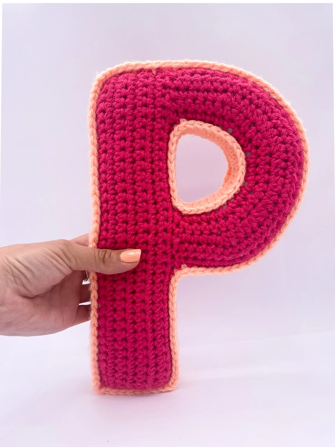 Crocheted P Cushion in Raspberry and Peachy Pink