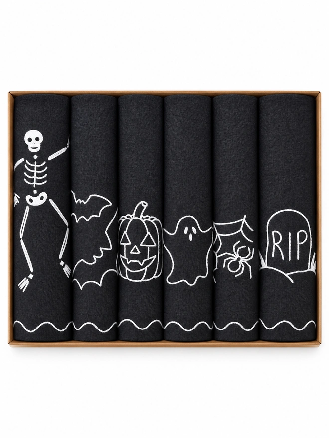 Black napkins with white embroidered Halloween 