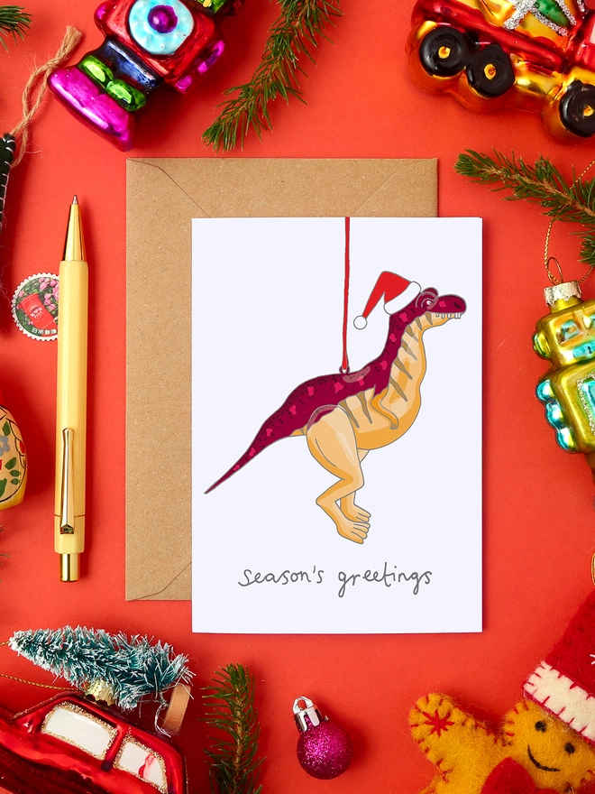 Quirky Christmas Card Featuring a Dinosaur Tree Decoration