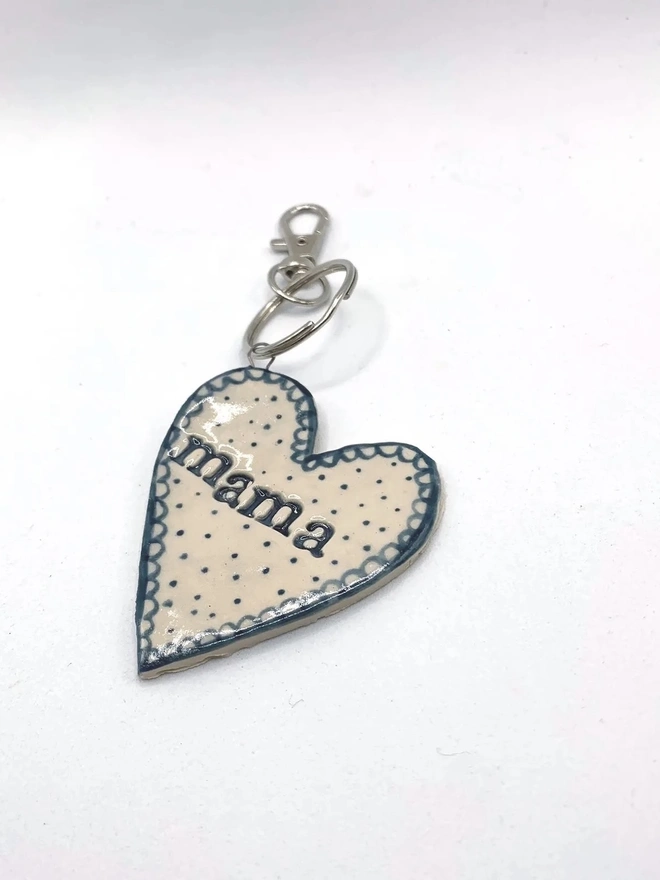 Mama Heart Ceramic Keyring, a blue keyring sitting on a plain white surface. 