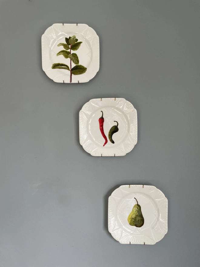 3 Shelley dainty plates on wall