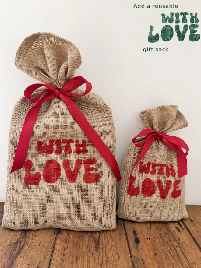 Large and small reusable jute gift sacks with handprinted WithLove and tied in red ribbon 