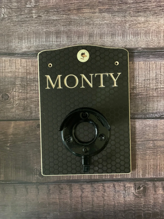 dark brown wooden bridle hanger