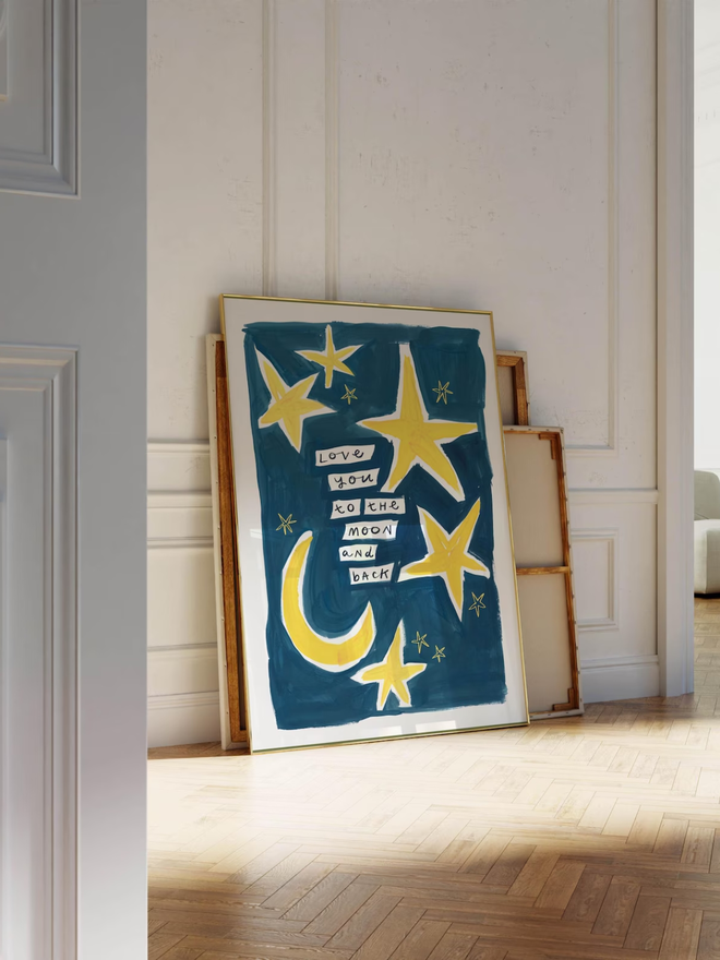'love you to the moon and back' print. an art print with a blue background, yellow moons and stars and a slogan.
