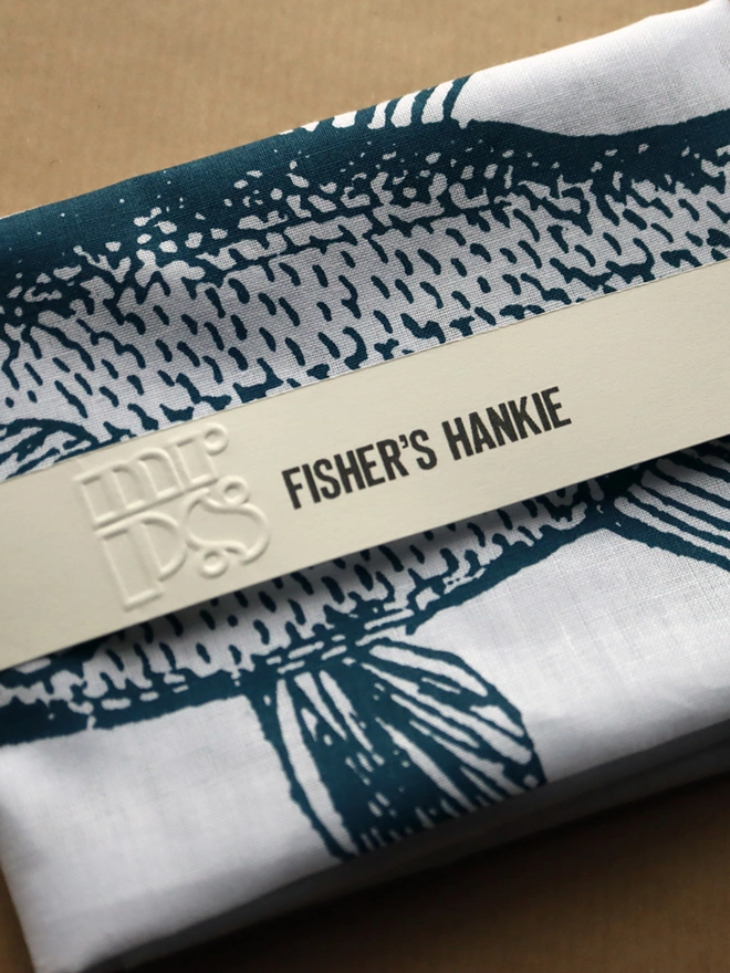 detail of a folded Mr.PS Fisher Hankie