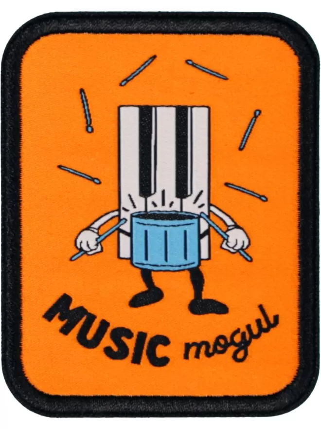 Orange patch with a black border. In the centre is a keyboard drumming, surrounded by drum sticks with 'music mogul' written underneath.